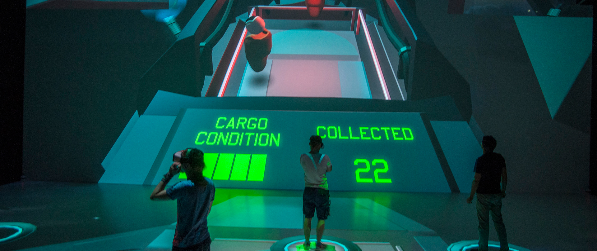 Two VR players and a spectator cooperating.